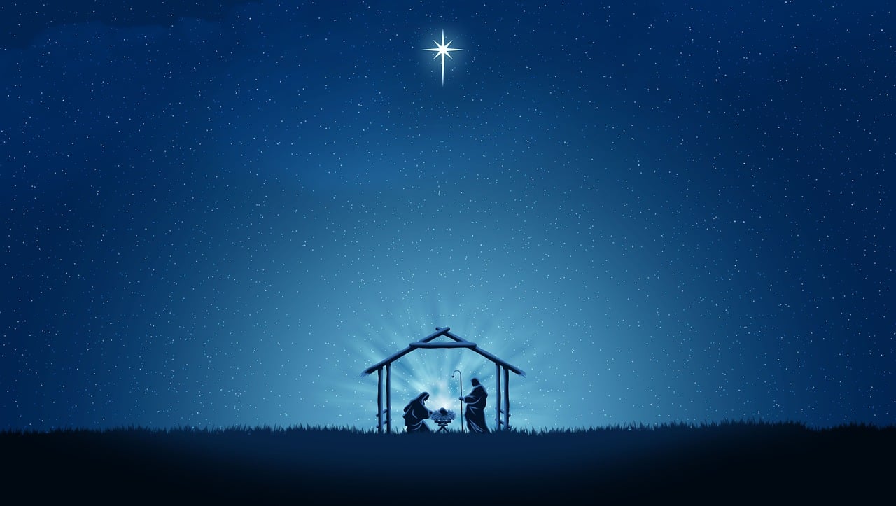 Image of Mary, Joseph and the baby Jesus in a stable under a star